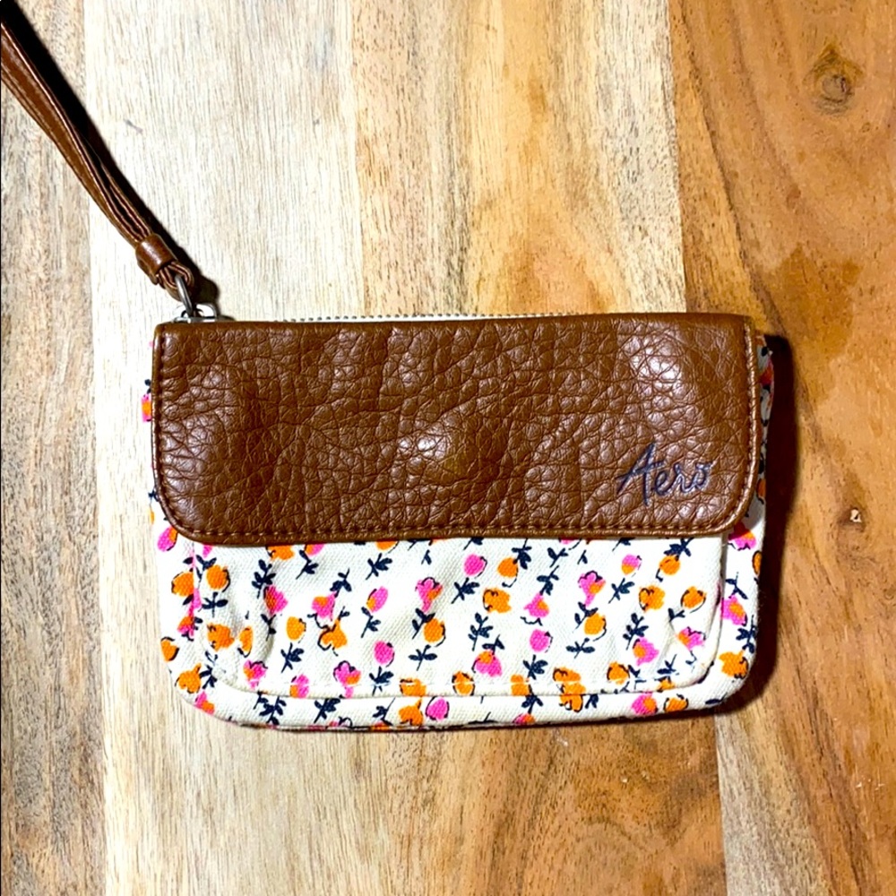 Floral cloth and brown leather wristlet